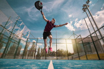 padel player playing a match in the open